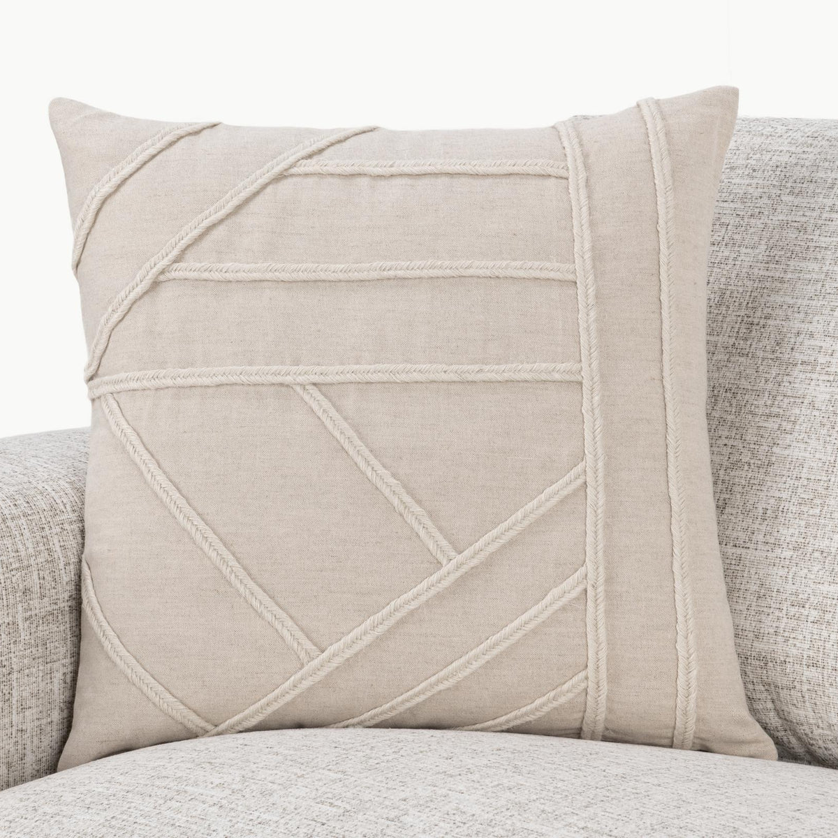 Langdon pillow with natural linen look and contrast-stitched geometric panel on front
