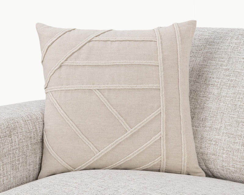 Langdon pillow with natural linen look and contrast-stitched geometric panel on front