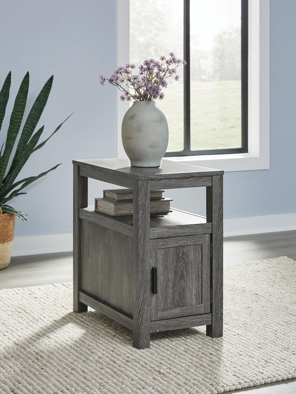 Chair side end table in dark gray wood with drawer-style cabinet door and shelf