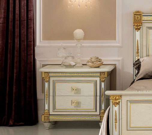 Beige nightstand with gold frame drawer, marble-look top, and ornate corner trim.