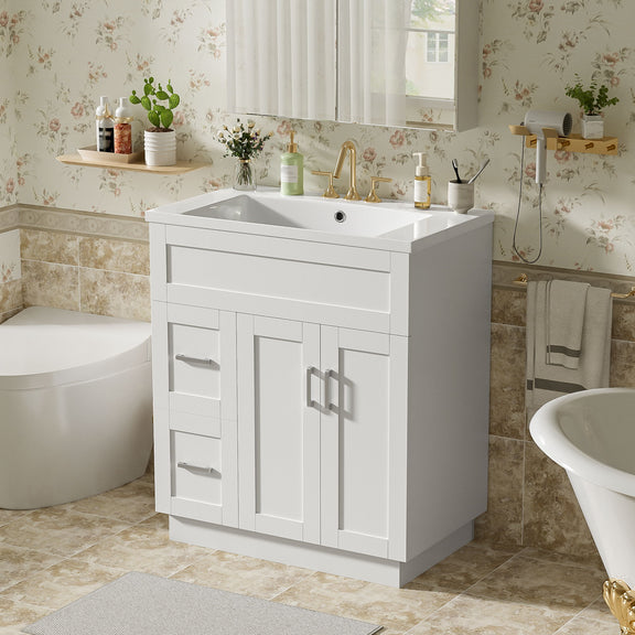 White bathroom vanity with sink, cabinet doors, and drawer fronts with bar pulls