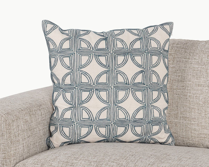 22 x 22 in navy geometric patterned pillow on upholstered sofa