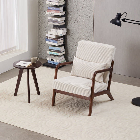 Beige upholstered mid-century accent chair with dark round walnut-tone coffee table