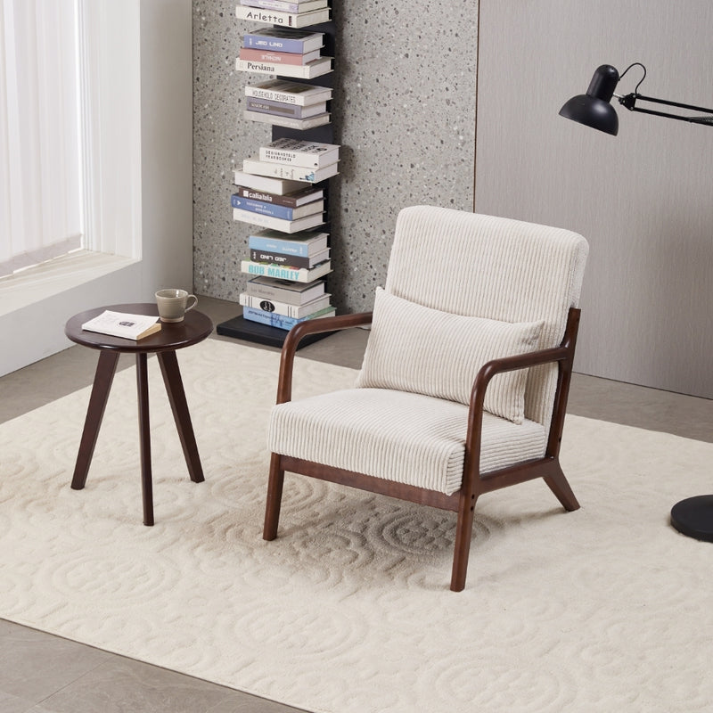 Beige upholstered mid-century accent chair with dark round walnut-tone coffee table