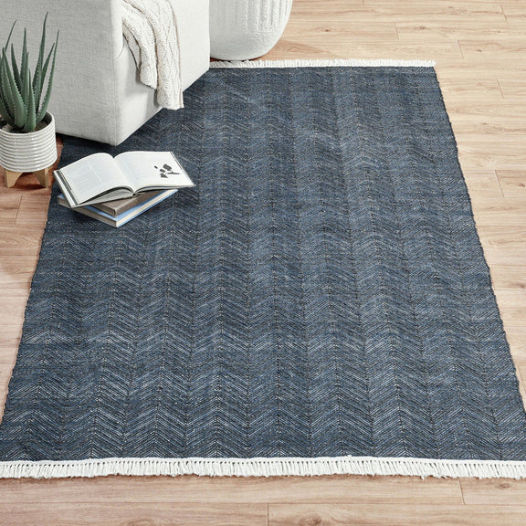 Blue chevron indoor/outdoor rug with white fringe border