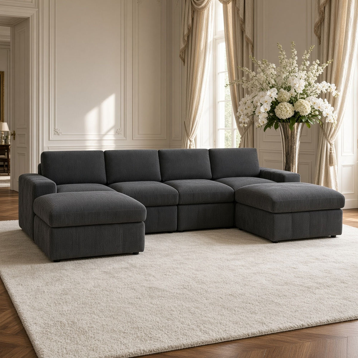 Dark gray modular sectional sofa with two chaise ottomans and tufted back