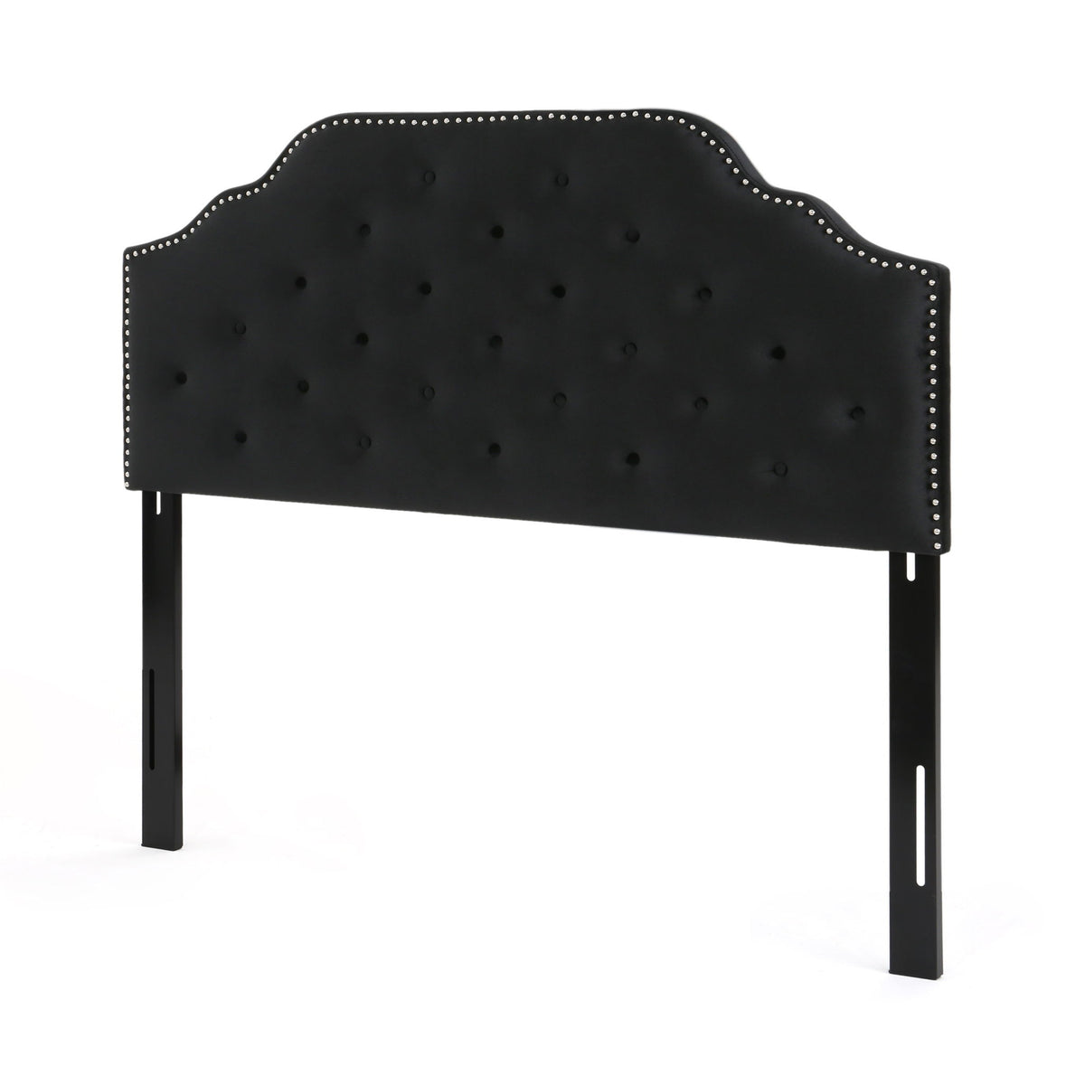 Black upholstered twin-size headboard with button tufting and nailhead trim, curved top