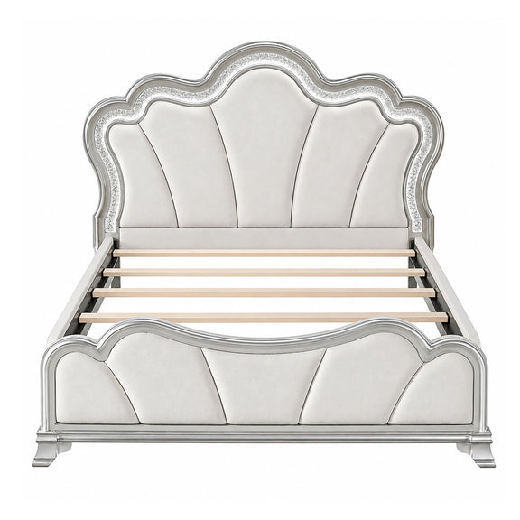 Silver upholstered platform bed with tufted panel headboard and curved footboard