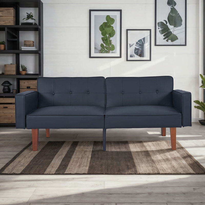 Dark navy sofa bed with button-tufted back, split seat back, and wooden legs