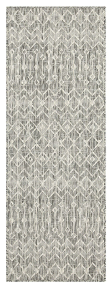 Indoor/outdoor polypropylene area rug, light gray with subtle ivory geometric chevron pattern.