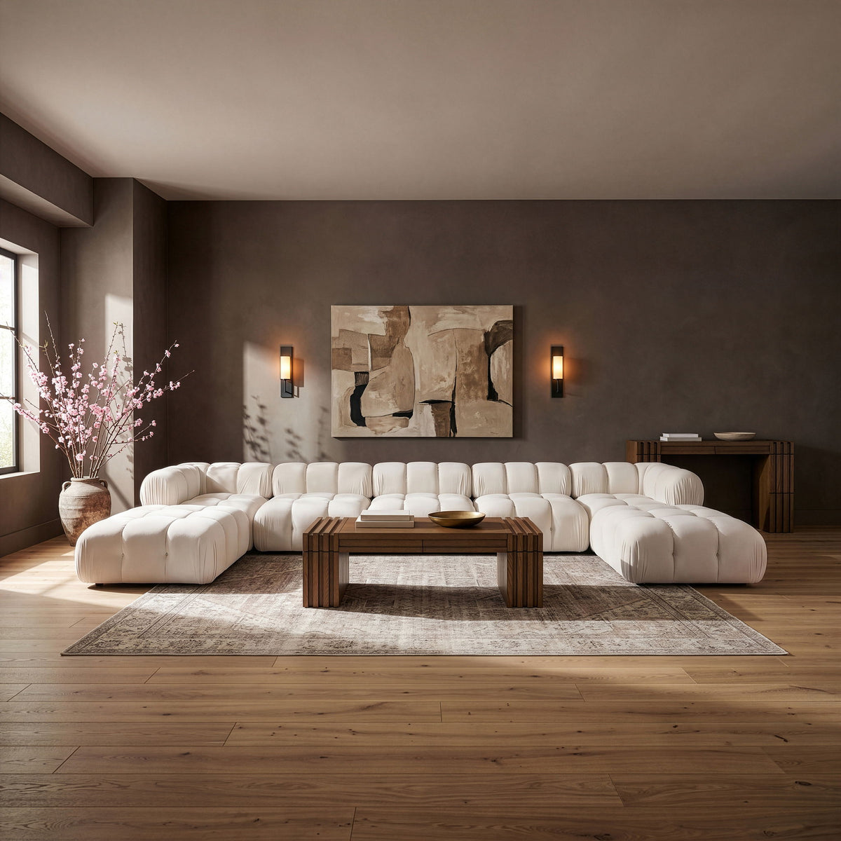 Beige modular sectional sofa with rounded back cushions and matching ottoman sections
