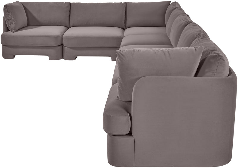 Gray velvet sectional sofa with rounded arm pads and cushioned backrest