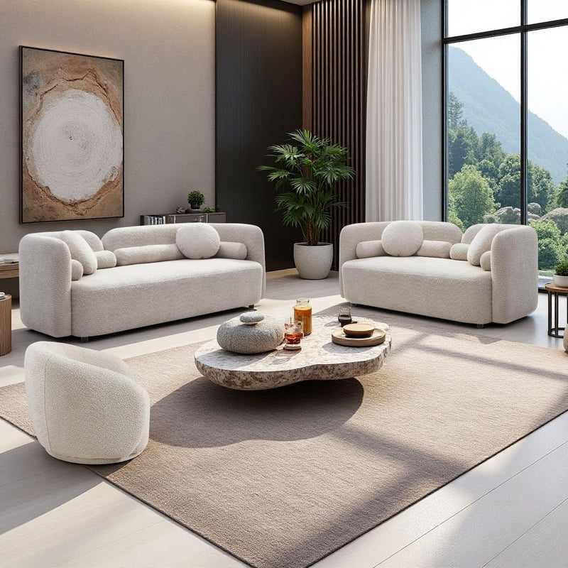Beige upholstered sofas with one armchair and round accent cushions