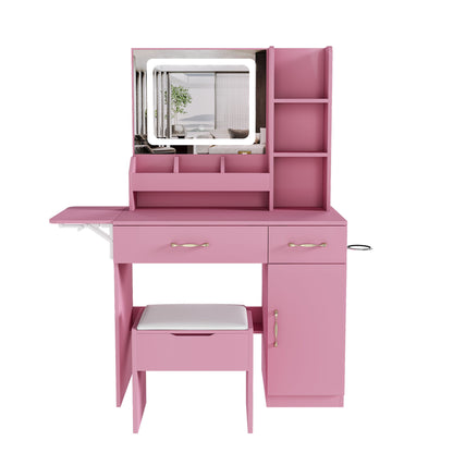 Pink vanity desk with LED-lit mirror, open shelves, drawers, cabinet, side extension, and stool