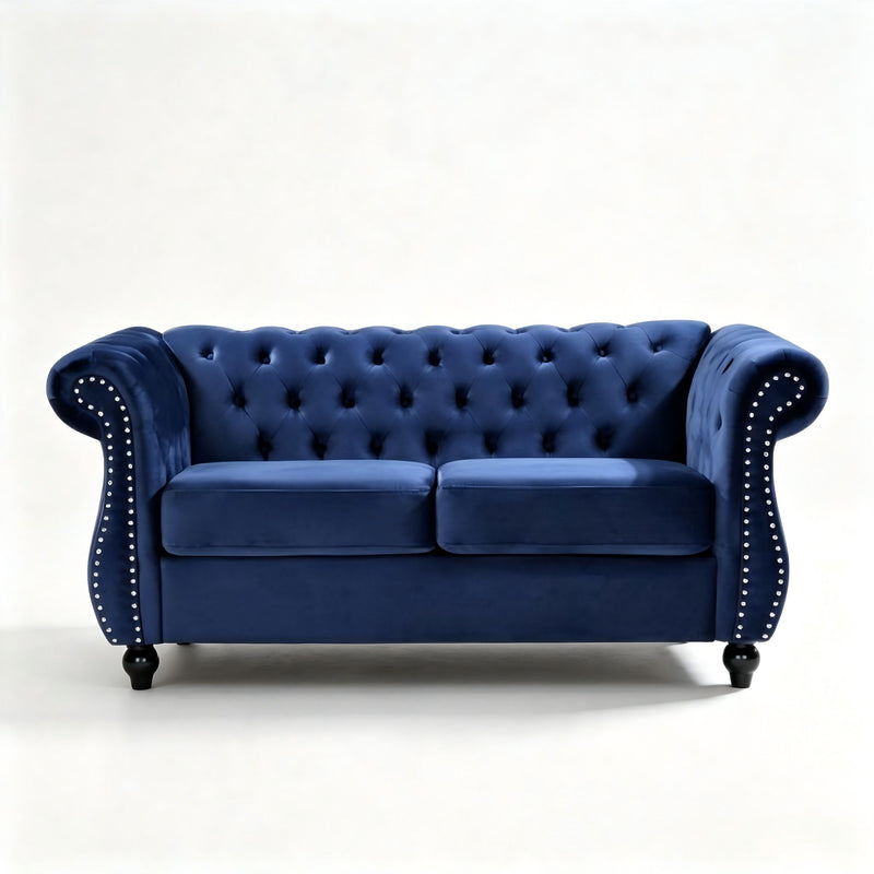 Blue tufted button loveseat with rolled arms and studded nailhead trim, two-seat design.