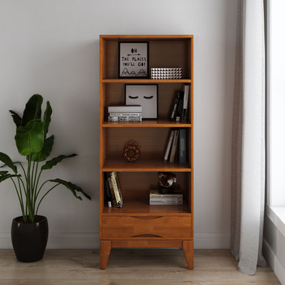 Light brown wood bookcase with open shelves and a bottom drawer for storage