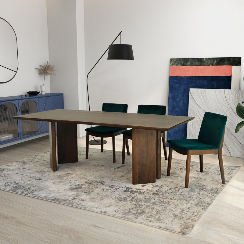 Dark oak dining table with four teal upholstered side chairs, dining set view