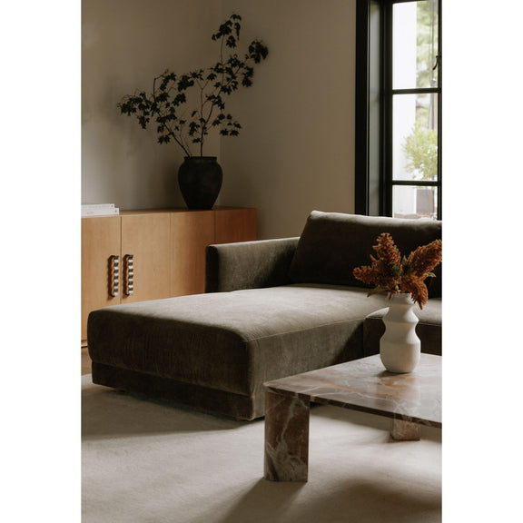 Cedar green sectional chaise with square arms and dark throw pillows
