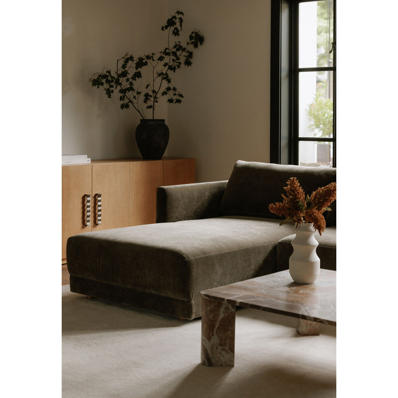 Cedar green sectional chaise with square arms and dark throw pillows