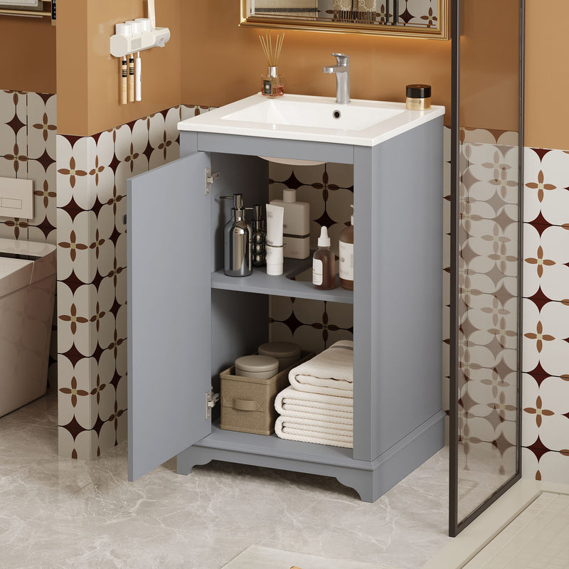 Bathroom vanity with sink, open cabinet door revealing adjustable shelf and storage