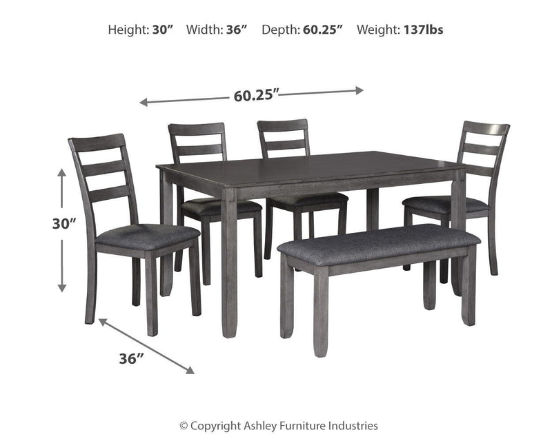 Gray dining table with five upholstered ladder-back chairs, dark wood legs