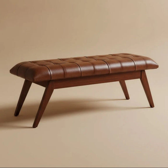 Cognac leather bench with tufted seat, rounded arms, and dark brown tapered legs