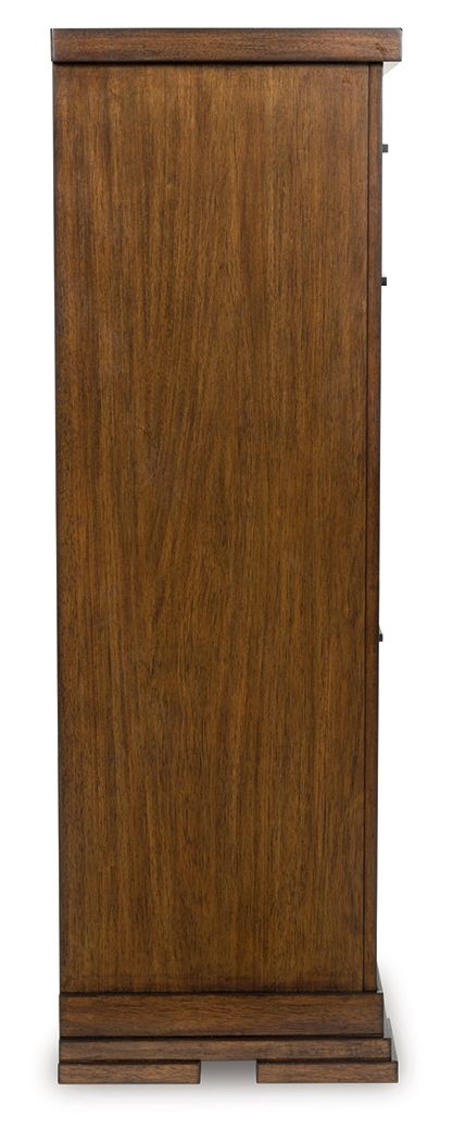 Medium brown side panel of a five-drawer chest with base legs and trim