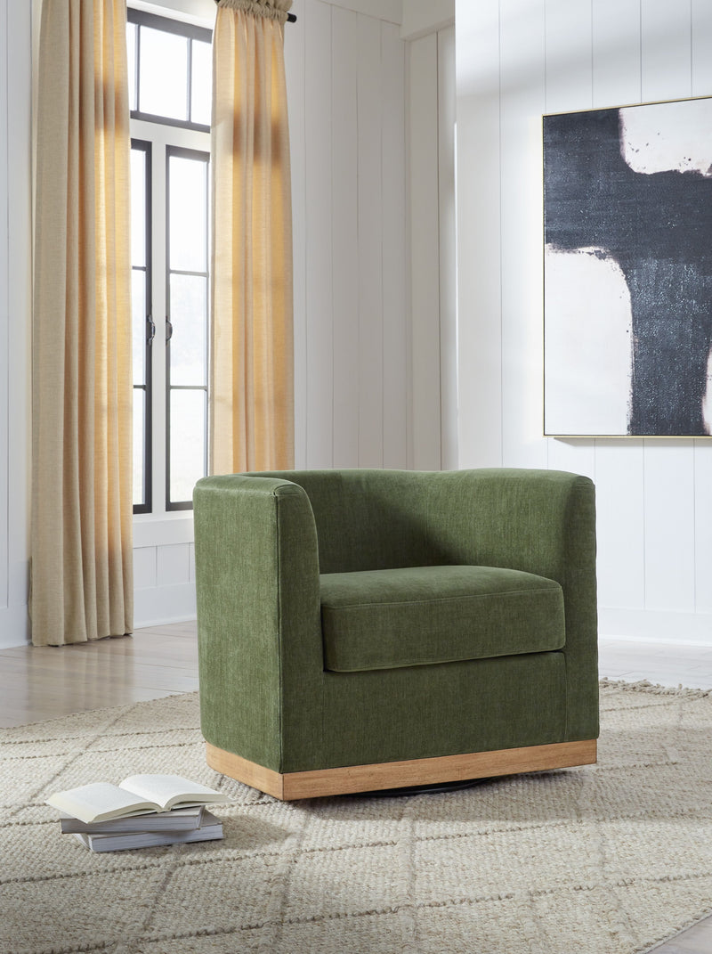 Forest green swivel chair in fabric with rounded arms and light wood base