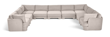 Light gray velvet modular sectional, 9-piece set with curved chaise side.