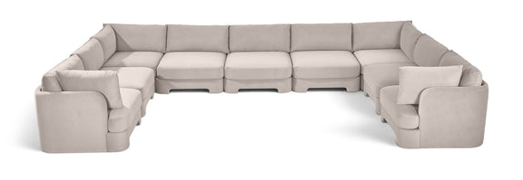 Light gray velvet modular sectional, 9-piece set with curved chaise side.