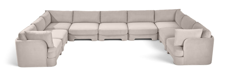 Light gray velvet modular sectional, 9-piece set with curved chaise side.