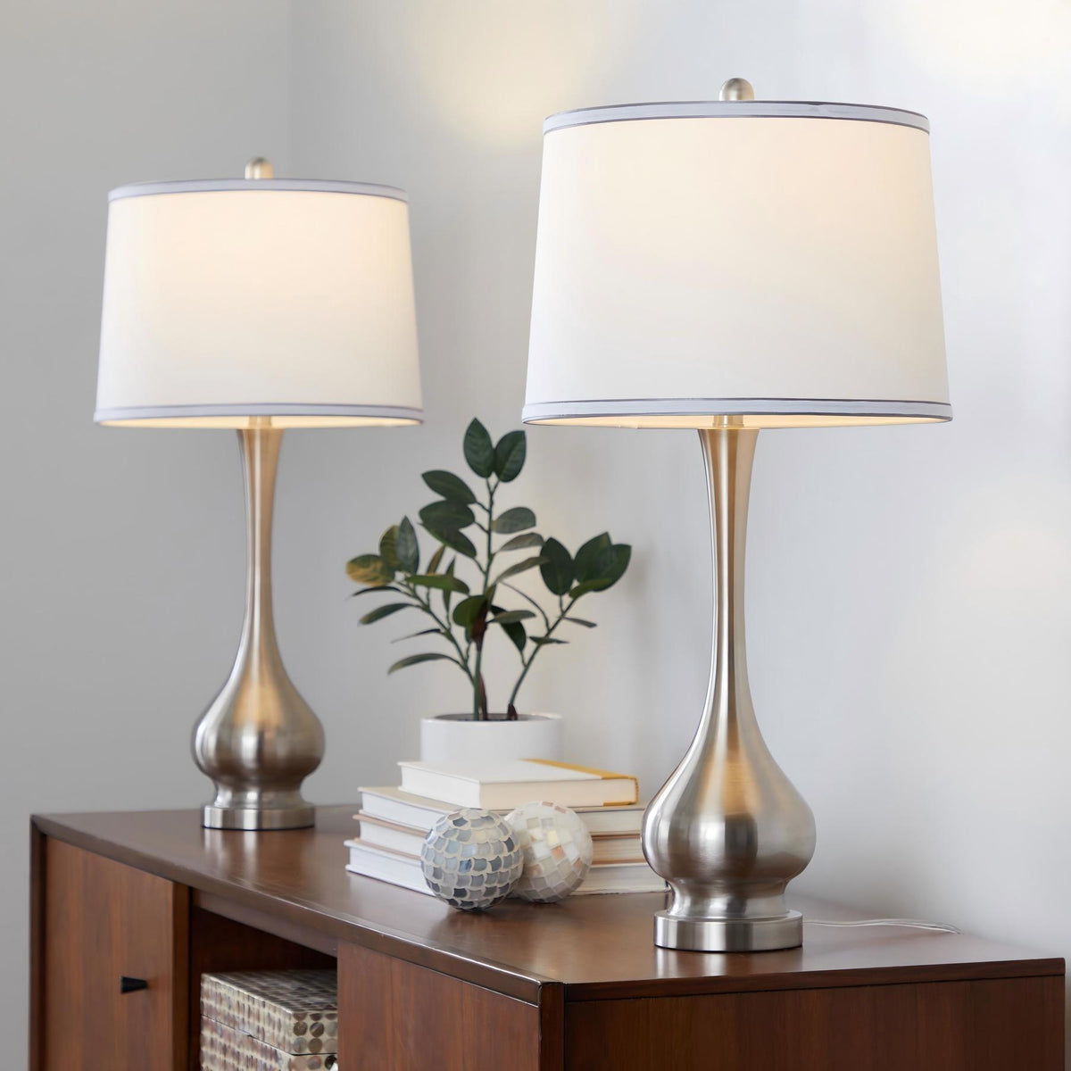 Set of 2 table lamps with tall nickel bases and white drum shades, silver trim