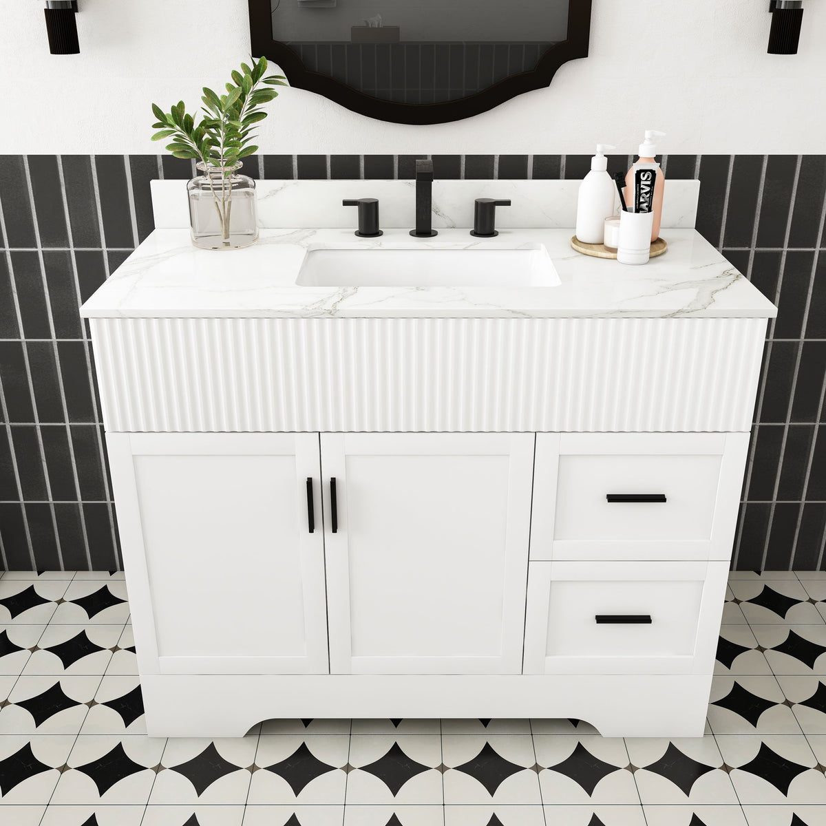 White bathroom vanity set with fluted cabinet, center sink, two doors and two drawers.