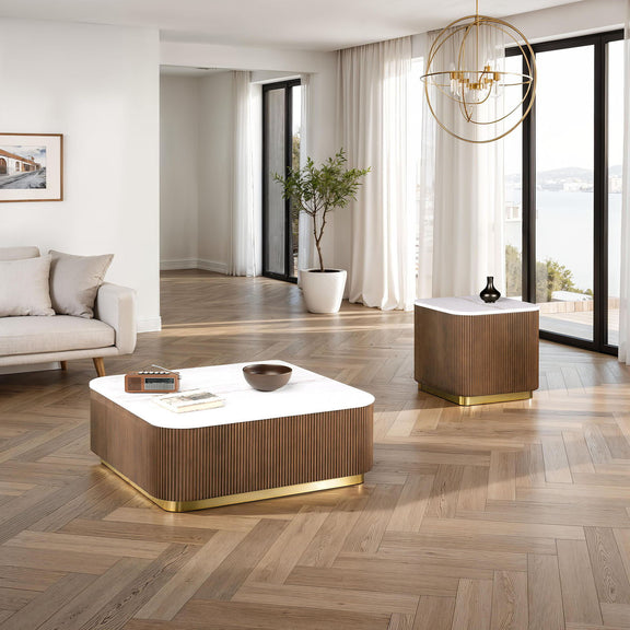 Square table with white marble-look top, dark brown ribbed sides, gold-toned base