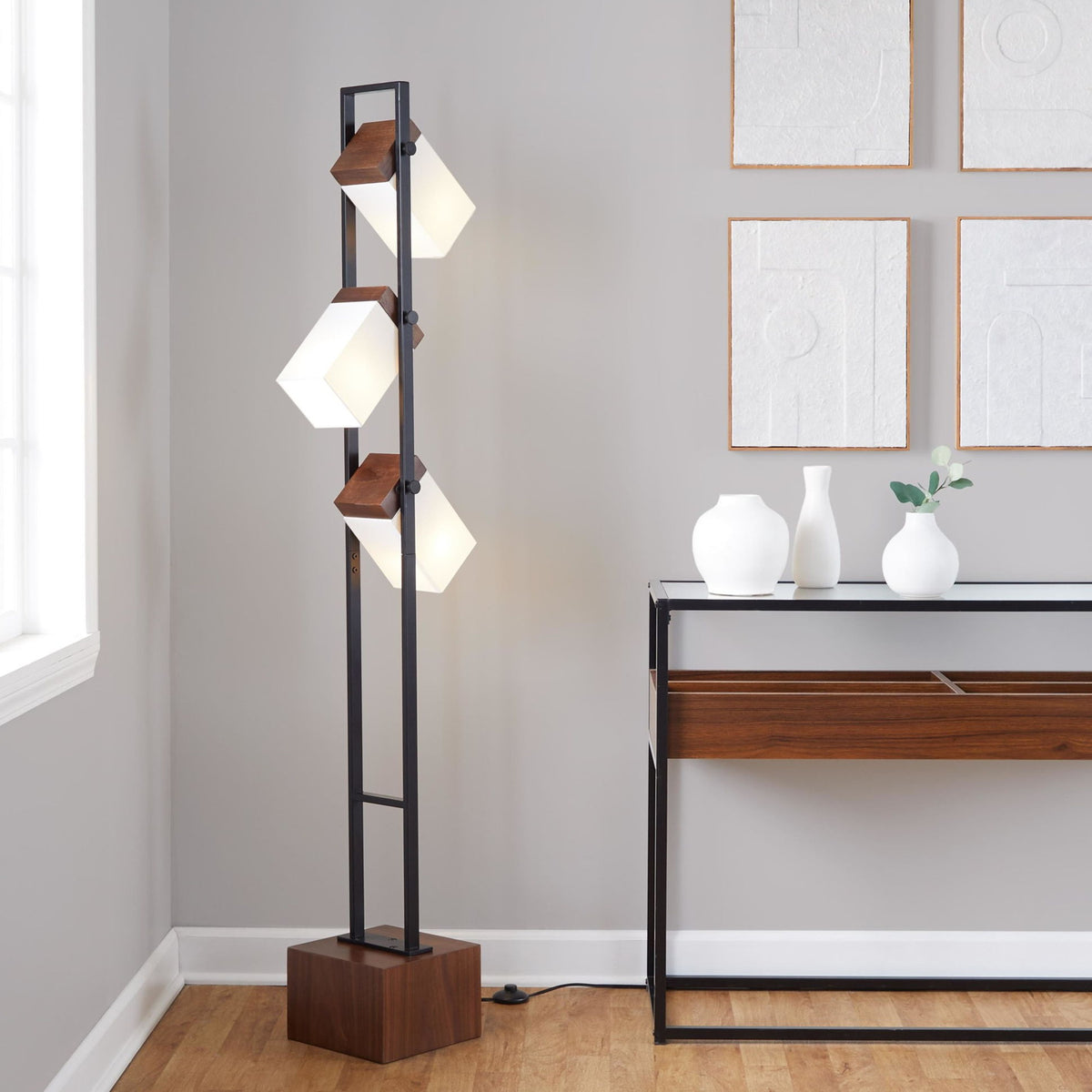 Tall black floor lamp with stacked white cube shades and walnut square base