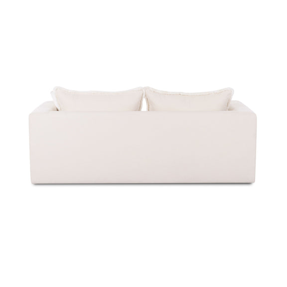 Cream-white boucle outdoor sofa with stacked seat and back cushions and two pillows