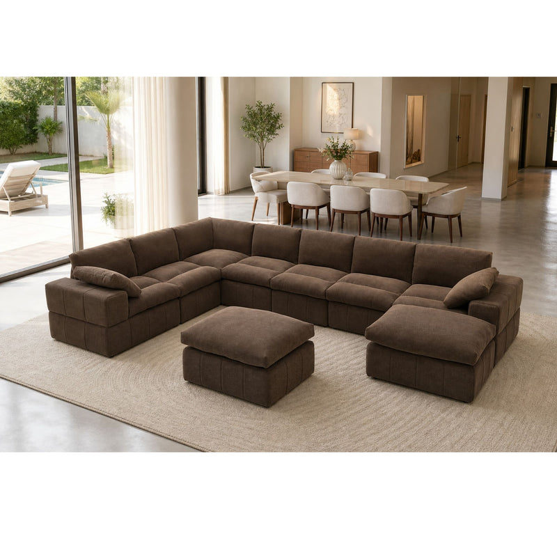 Dark brown sectional sofa with two ottomans and toss pillows