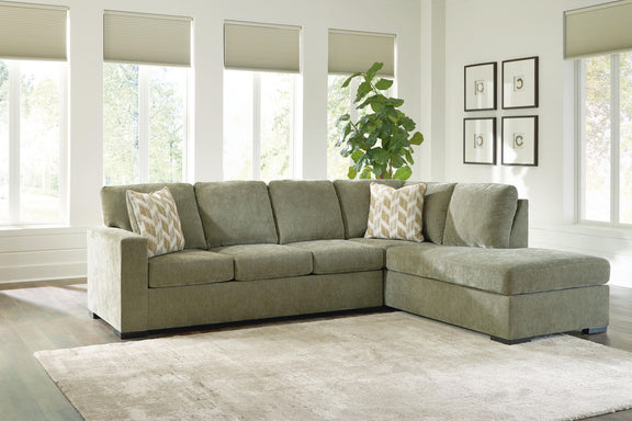 Bridgepoint sectional sofa with corner chaise, light gray upholstery, patterned throw pillows