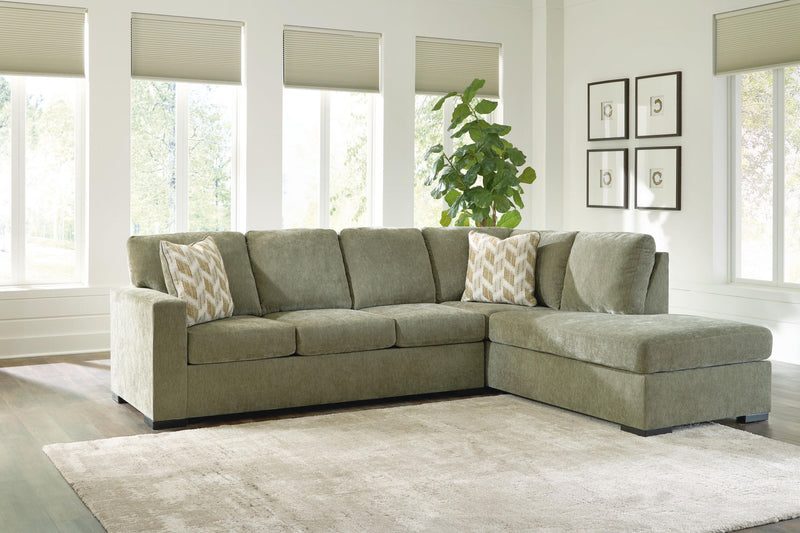 Bridgepoint sectional sofa with corner chaise, light gray upholstery, patterned throw pillows
