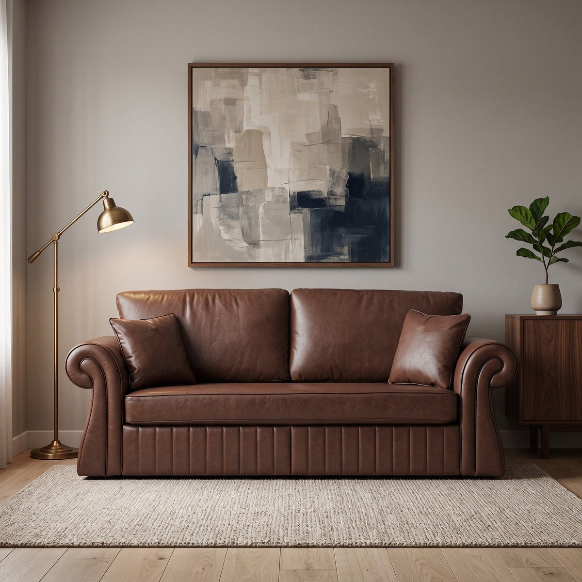 Dark brown three-seat sofa with rolled arms and two pillows, shown in a living room