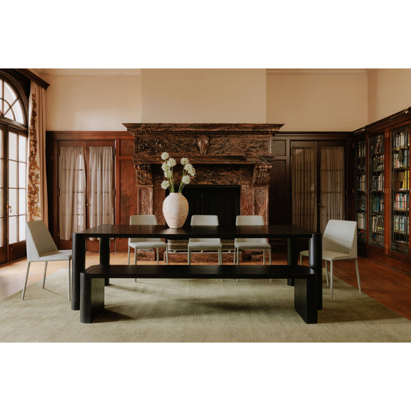 Large dining table in dark finish with rectangular top and four thick square legs