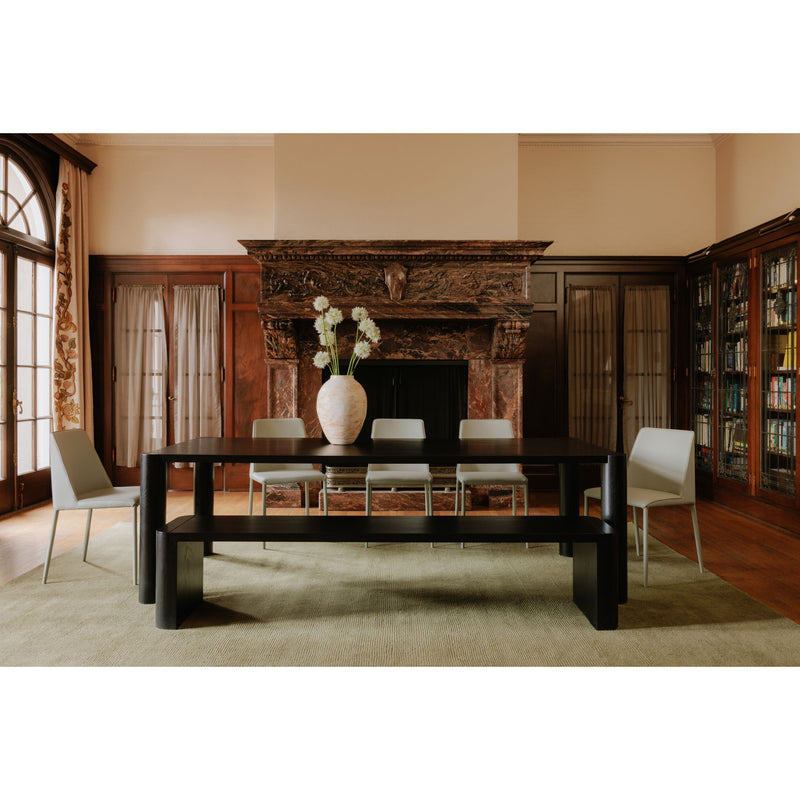 Large dining table in dark finish with rectangular top and four thick square legs