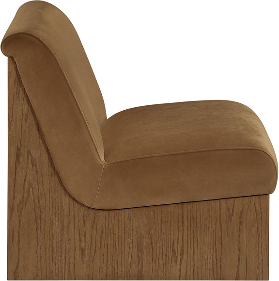 Velvet accent chair with tan fabric and curved armrest detail, walnut-toned wood frame.