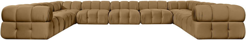 Light brown velvet upholstered sectional sofa with tufted cushions and curved end arms