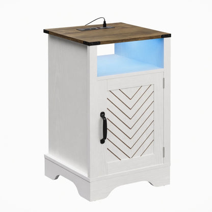 White farmhouse nightstand with wood top, open shelf, and chevron door panels