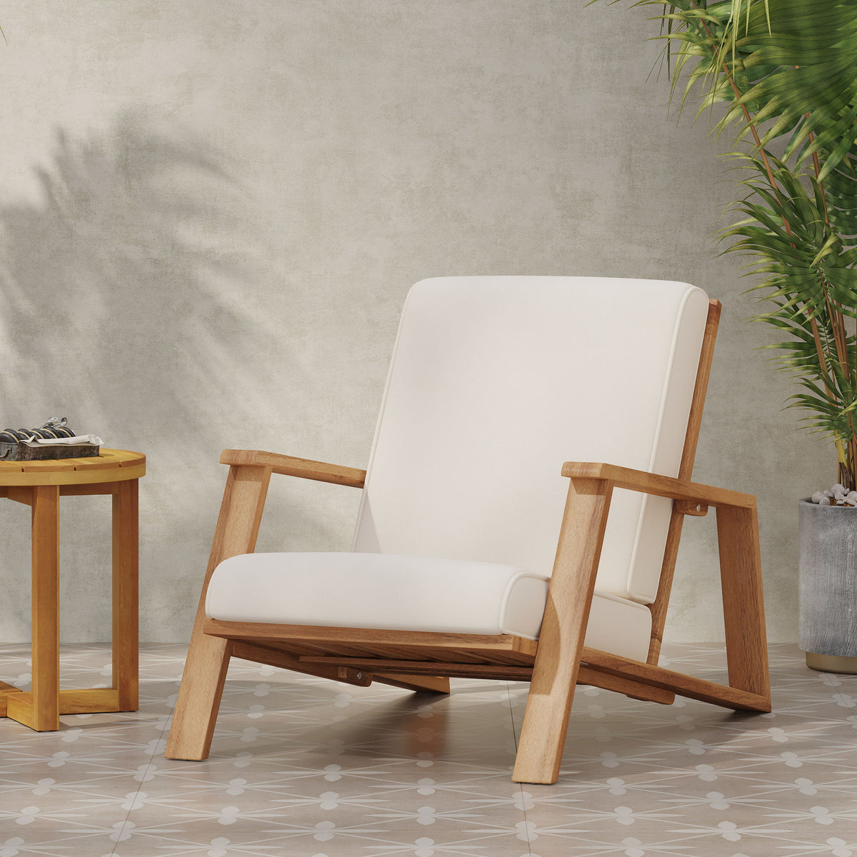 Beige padded outdoor lounge chair with light wood frame and angled armrests
