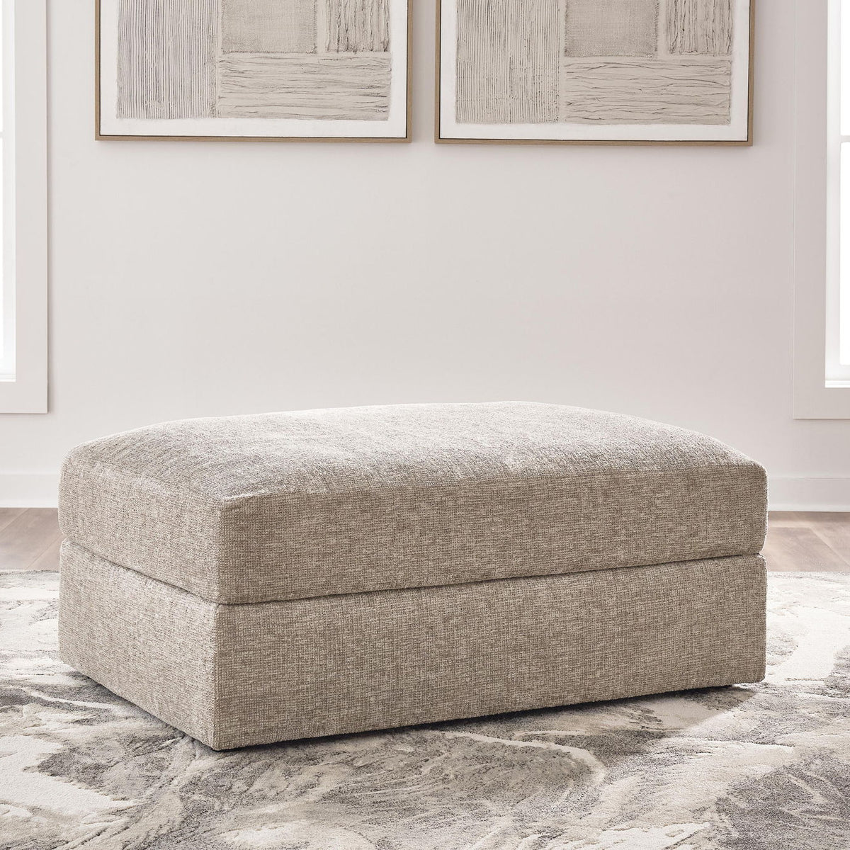 Oversized accent ottoman, light beige fabric with low rectangular padded profile