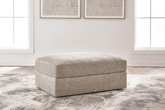Oversized accent ottoman, light beige fabric with low rectangular padded profile