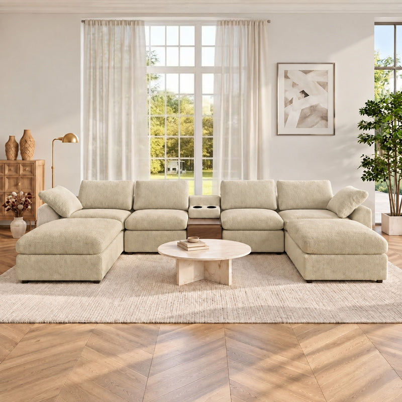 Light beige modular sectional sofa with storage console, chaise ottomans and cushions