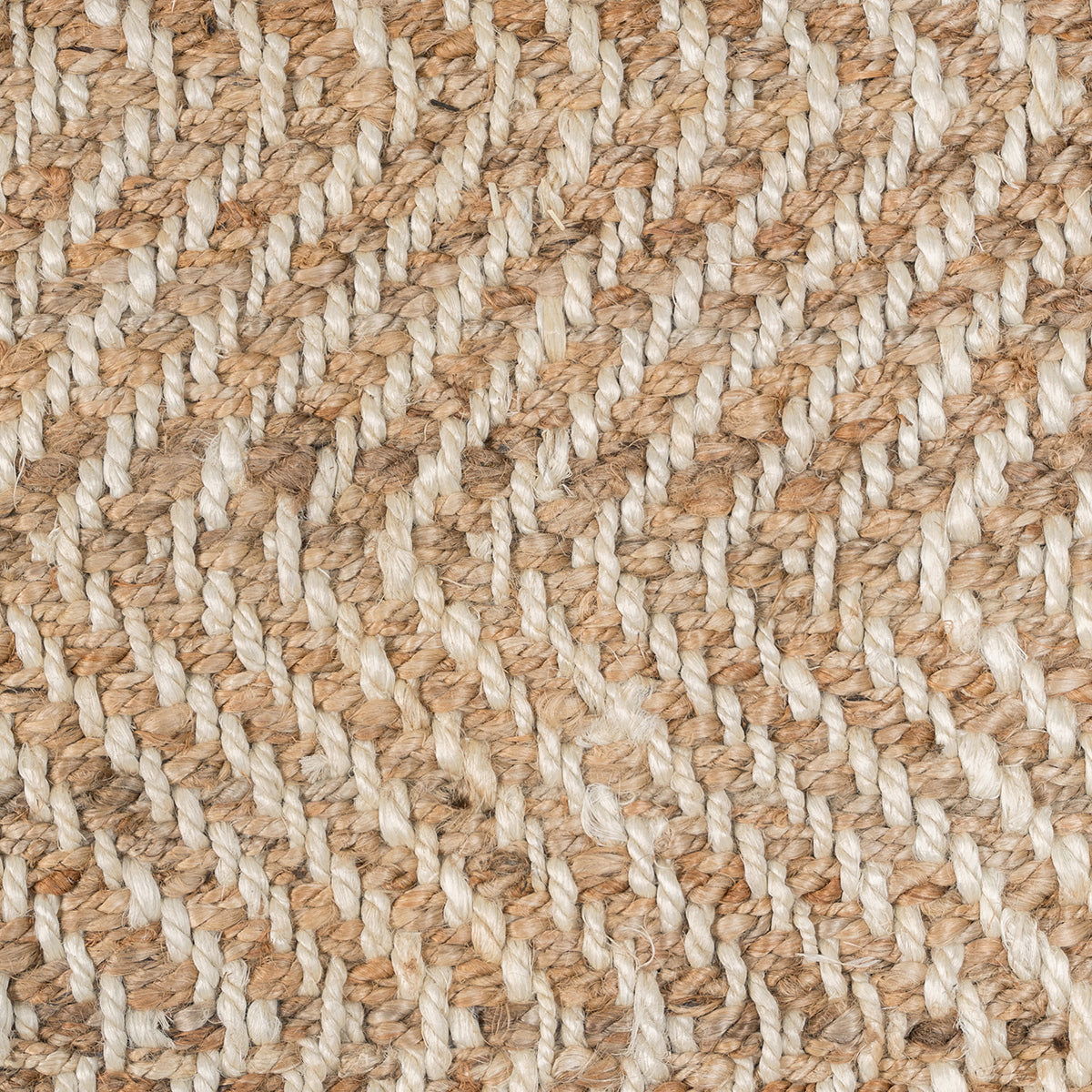 Close-up of natural jute fibers showing herringbone chevron weave texture.